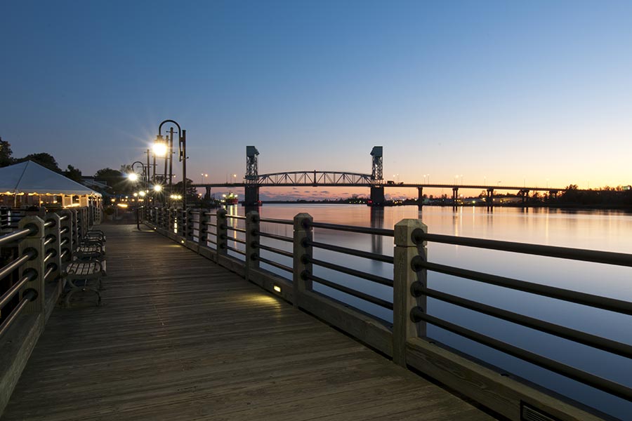 The Wilmington Riverwalk offers beautiful views in the evenings.